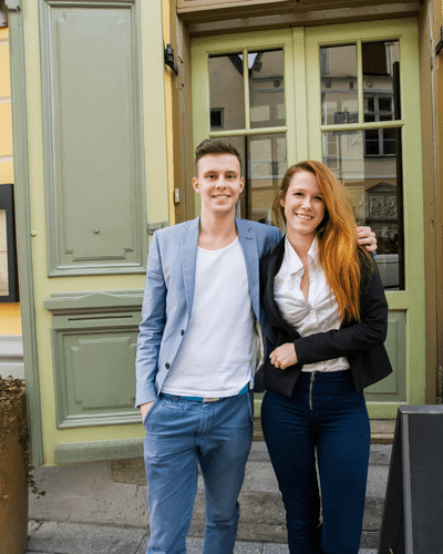Man smiling at the camera in a garden centre environment