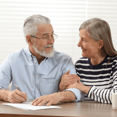 Man smiling at the camera in a garden centre environment
