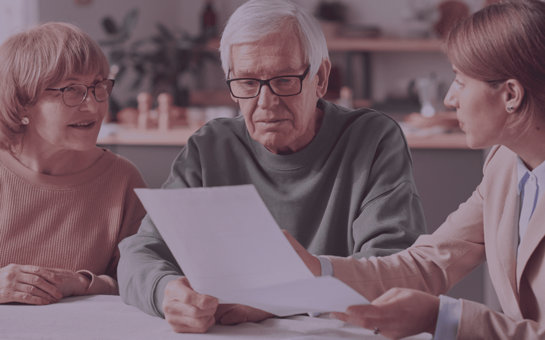 fradulent will? elder couple sit a table looking at a document with a third party