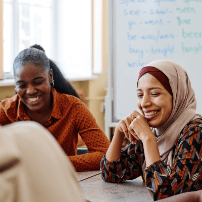 employment law advice - two people sit across a table looking down at documents